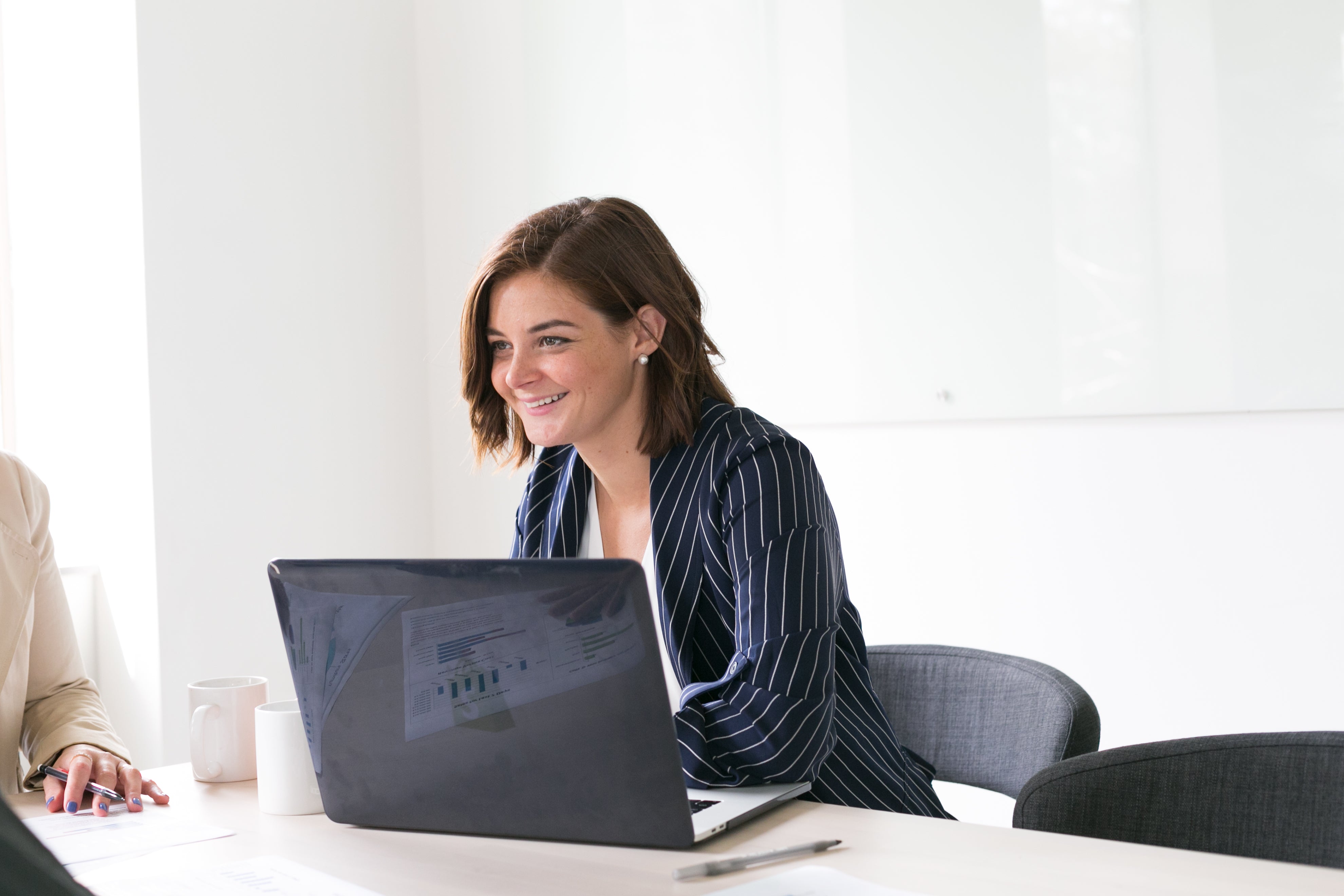 files/woman-smiling-with-laptop.jpg